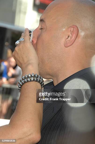Actor Vin Diesel posing at the ceremony that honored him with a Star on the Hollywood Walk of Fame.