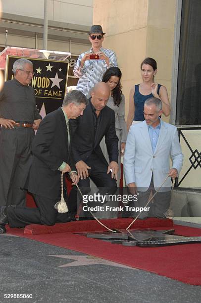 Actor Vin Diesel and guests pose at the ceremony that honored him with a Star on the Hollywood Walk of Fame.