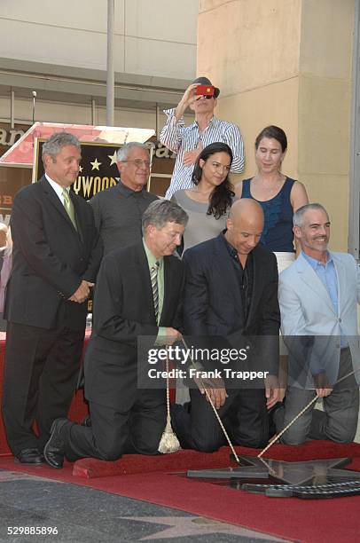 Actor Vin Diesel and guests pose at the ceremony that honored him with a Star on the Hollywood Walk of Fame.