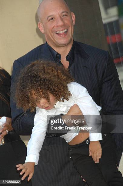 Actor Vin Diesel and son pose at the ceremony that honored him with a Star on the Hollywood Walk of Fame.