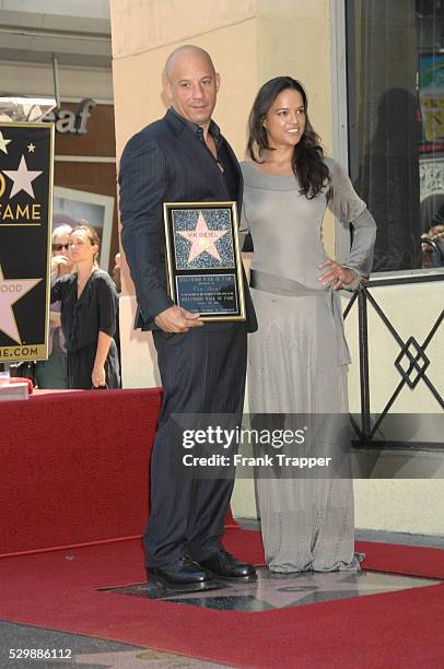 Actor Vin Diesel and actress Michelle Rodriguez pose at the ceremony that honored him with a Star on the Hollywood Walk of Fame.