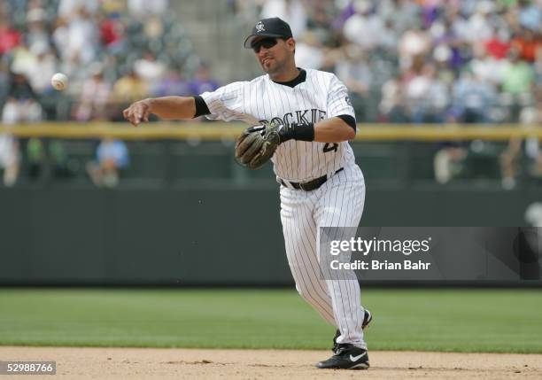 Luis Gonzalez of the Colorado Rockies throws the ball against the San Francisco Giants during the game at Coors Field on April 17, 2005 in Denver,...