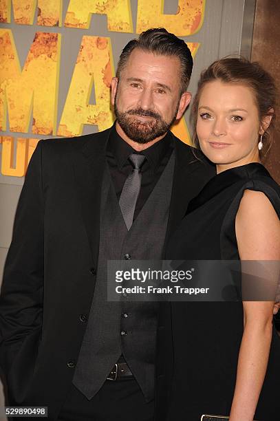Actor Anthony LaPaglia and guest arrive at the premiere of "Mad Max: Fury Road" held at the TCL Chinese Theater in Hollywood.