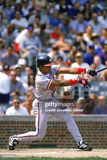 Andruw Jones of the Atlanta Braves bats during the game against the Chicago Cubs at Wrigley Field on September 1, 1996 in Chicago, Illinois. The Cubs...