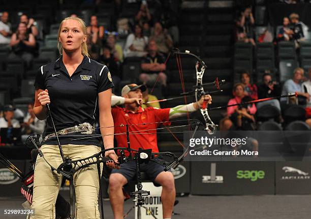 Competitors Luc Martin and Chasity Kuczer shoot during the Archery Finals at the Invictus Games at ESPN Wide World of Sports complex on May 9, 2016...