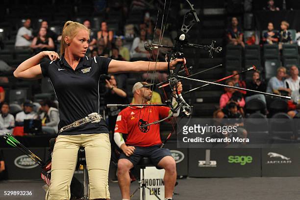 Competitors Luc Martin and Chasity Kuczer shoot during the Archery Finals at the Invictus Games at ESPN Wide World of Sports complex on May 9, 2016...