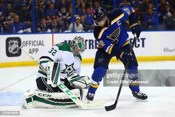 Kari Lehtonen of the Dallas Stars makes a save against David Backes of the St. Louis Blues in Game Six of the Western Conference Second Round during...