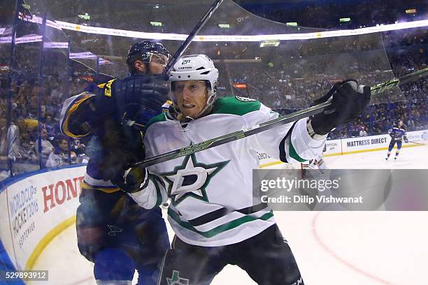 Cody Eakin of the Dallas Stars checks Troy Brouwer of the St. Louis Blues in Game Six of the Western Conference Second Round during the 2016 NHL...