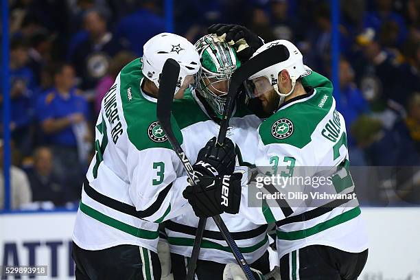 John Klingberg, Kari Lehtonen and Kari Lehtonen of the Dallas Stars celebrate after beating the St. Louis Blues in Game Six of the Western Conference...