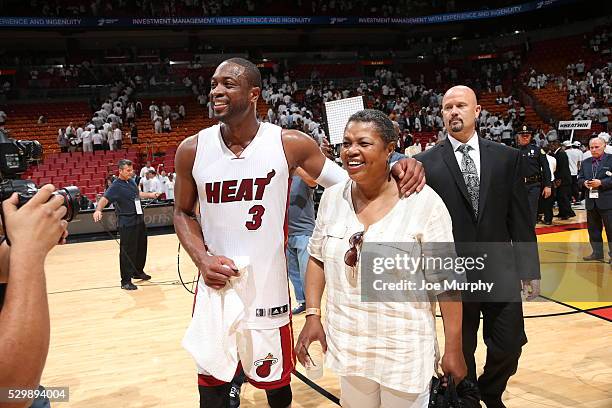 Dwyane Wade of the Miami Heat and his mom Jolinda Wade celebrate a victory against the Toronto Raptors in Game Four of the Eastern Conference...