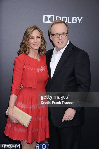 Director Brad Bird and guest arrive at the world premiere of "Tomorrowland" held at the AMC Downtown Disney 12 theaters.