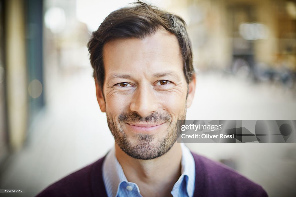 Portrait of smiling mature man outdoors
