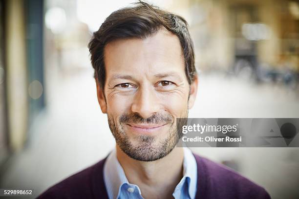 portrait of smiling mature man outdoors - 40 year old man stock pictures, royalty-free photos & images