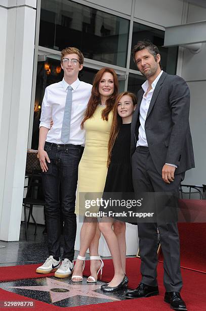 Actress Julianne Moore is joined by her family, son Cal Freundlich, daughter Liv Freundlich and husband Bart Freundlich as she is honored with a Star...