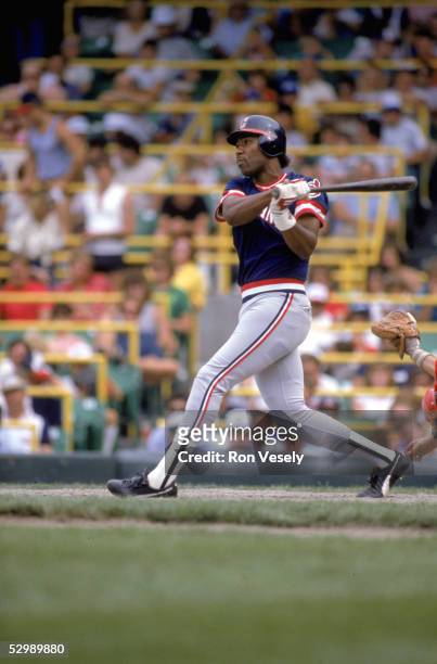 Joe Carter of the Cleveland Indians swings at the pitch during a season game. Joe Carter played for the Cleveland Indians from 1984-1989.