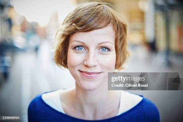 portrait of smiling woman outdoors - auburn hair stock pictures, royalty-free photos & images