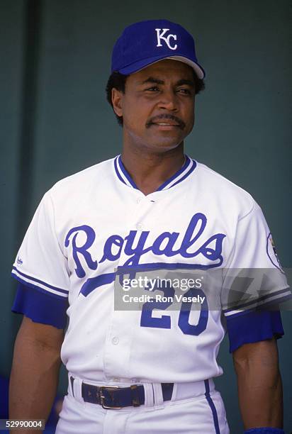 Frank White of the Kansas City Royals looks on from the dugout during a 1988 season game. Frank White played for the Kansas City Royals from...