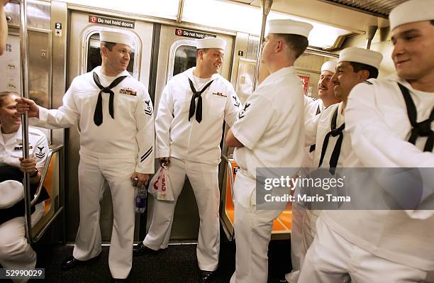 Navy sailors from the USS John F. Kennedy ride on the subway during Fleet Week May 27, 2005 in New York City. Fleet Week honors American servicemen...