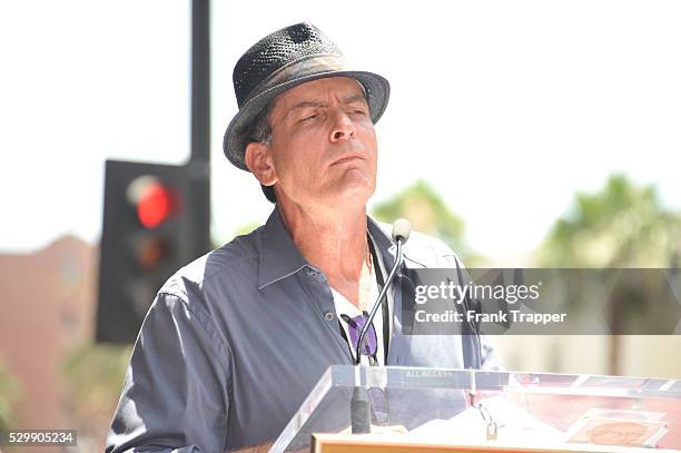 Guest speaker, actor Charlie Sheen attends the ceremony honoring musician Slash with a Star on the Hollywood Walk of Fame in front of the Hard Rock...