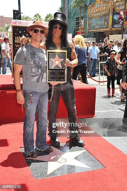 Actors Charlie Sheen and Clifton Collins attend the ceremony that honored musician, Slash with a Star on the Hollywood Walk of Fame in front of the...