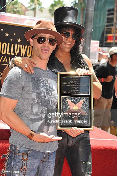 Actors Charlie Sheen and Clifton Collins attend the ceremony that honored musician, Slash with a Star on the Hollywood Walk of Fame in front of the...