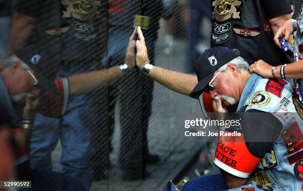 Vietnam Vet Mike McDole cries after seeing the name of a friend who he served with inscribed on The Wall May 27, 2005 in Washington, DC. McDole is in...