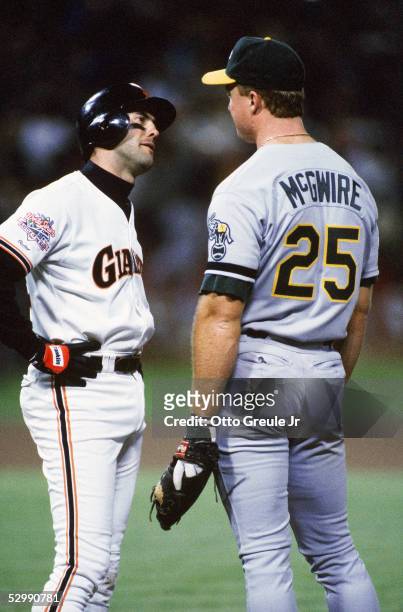 Will Clark of the San Francisco Giants has words with Mark McGwire of the Oakland Athletics during the 1989 World Series at Candlestick Park in...