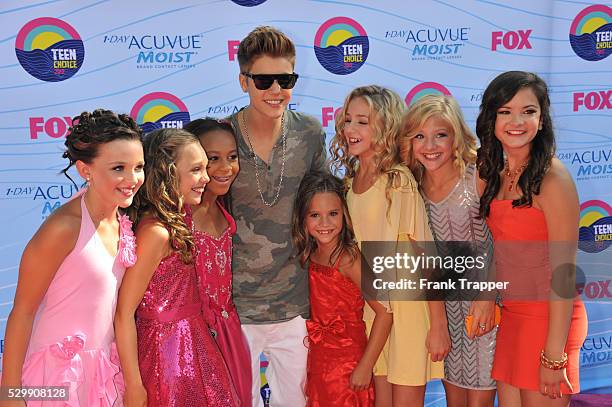Singer Justin Bieber and the stars of Dance Moms arrive at the 2012 Teen Choice Awards held at the Gibson Amphitheatre in Universal City, California.