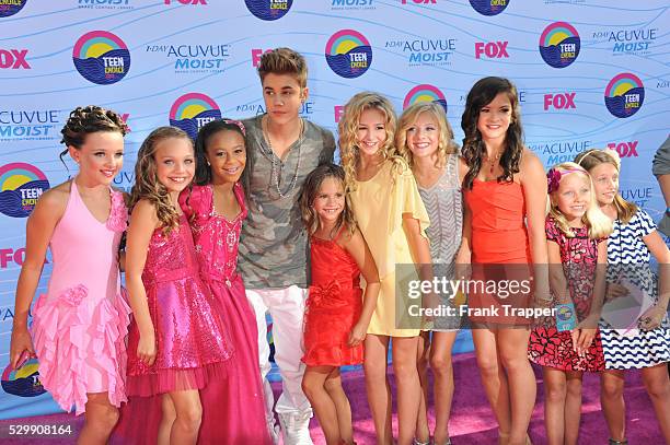 Singer Justin Bieber and the stars of Dance Moms arrive at the 2012 Teen Choice Awards held at the Gibson Amphitheatre in Universal City, California.