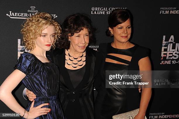 Actors Julia Garner, Lily Tomlin and Marcia Gay Harden arrive at the Los Angeles Film Festival opening night premiere of "Grandma" held at Regal...