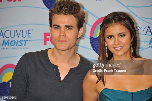 Actors Paul Wesley and Nina Dobrev, winners of Choice Fantasy/Sci-Fi Show award, pose in the press room at the 2012 Teen Choice Awards held at the...