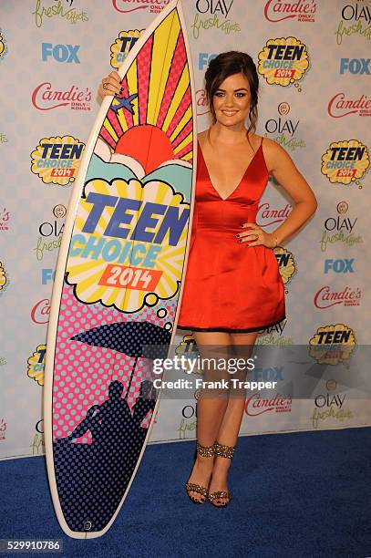 Actress Lucy Hale posing in the press room at the 2014 Teen Choice Awards held at the Shrine Auditorium.