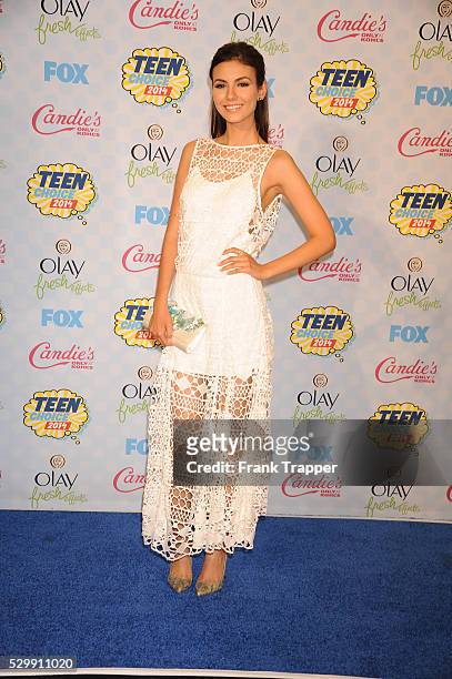 Actress Victoria Justice posing in the press room at the 2014 Teen Choice Awards held at the Shrine Auditorium.