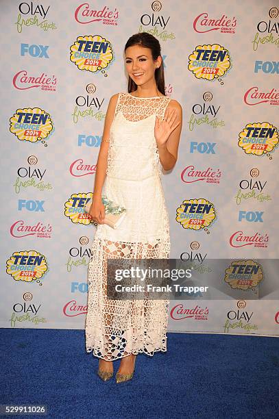 Actress Victoria Justice posing in the press room at the 2014 Teen Choice Awards held at the Shrine Auditorium.