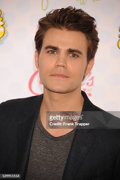 Actor Paul Wesley arrives at the 2014 Teen Choice Awards held at the Shrine Auditorium.