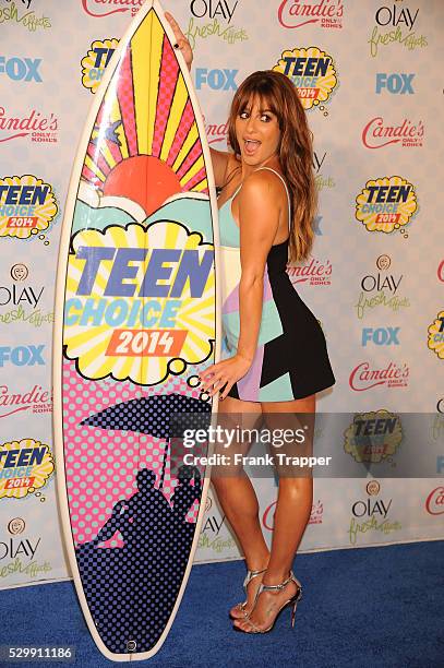 Actress Lea Michele posing in the press room at the 2014 Teen Choice Awards held at the Shrine Auditorium.