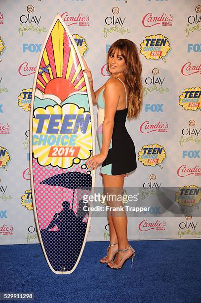 Actress Lea Michele posing in the press room at the 2014 Teen Choice Awards held at the Shrine Auditorium.