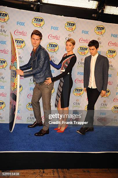 Actors Ansel Elgort, Shailene Woodley and Nat Wolff pose in the press room at the 2014 Teen Choice Awards held at the Shrine Auditorium.