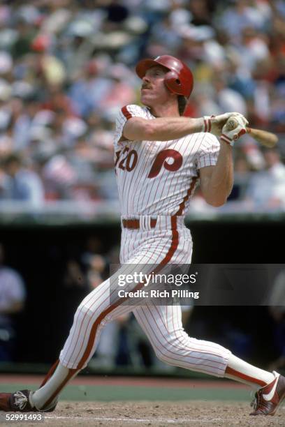 Mike Schmidt of the Philadelphia Phillies bats during a 1984 MLB game at Veterans Stadium in Philadelphia, Pennsylvania. Mike Schmidt played for the...