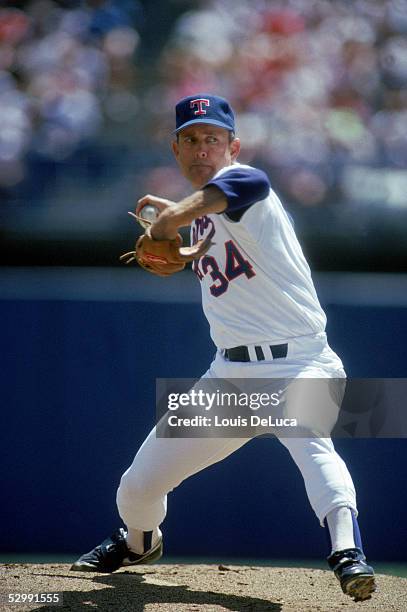 Nolan Ryan of the Texas Rangers pitches during a 1989 MLB game at The Ballpark in Arlington in Arlington, Texas.