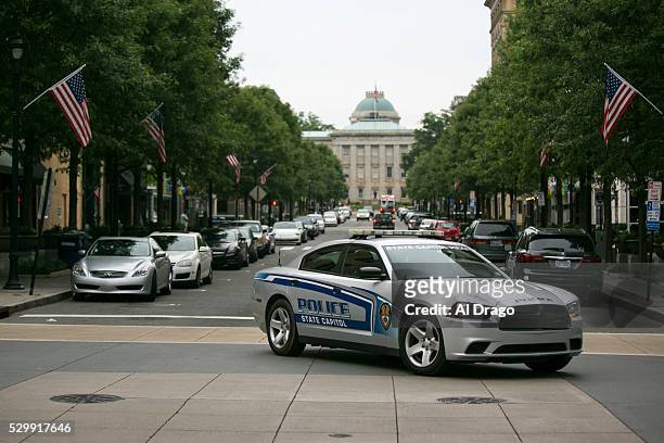 State Capitol Police car drives near the North Carolina State Capitol on Fayetteville Street in Raleigh, N.C., on Monday, May 9, 2016. Gov. Pat...