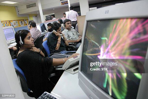 Indian employees of the Quark call center work during their night shift, late 09 May 2005 in Mohali, in India's northern state of Punjab. Bangalore...