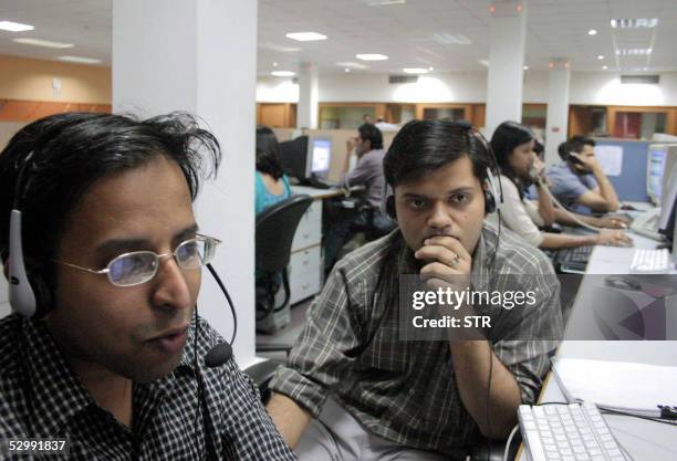 Indian employees of the Quark call center work during their night shift, late 09 May 2005 in Mohali, in India's northern state of Punjab. Bangalore...