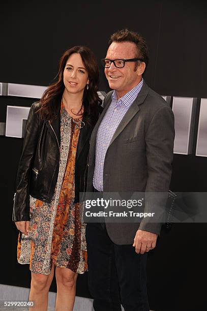 Actor Tom Arnold and wife Ashley Groussman arrive at the premiere of "Terminator Genisys" held at the Dolby Theater in Hollywood.