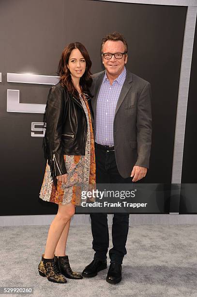 Actor Tom Arnold and wife Ashley Groussman arrive at the premiere of "Terminator Genisys" held at the Dolby Theater in Hollywood.