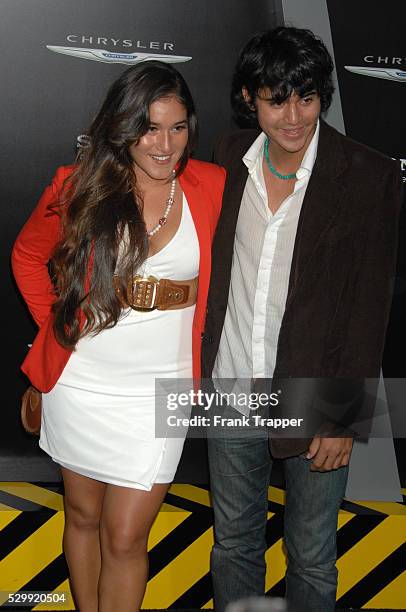 Actress Q'Orianka Kilcher and guest arrive at the premiere of Total Recall held at Grauman's Chinese Theater in Hollywood.