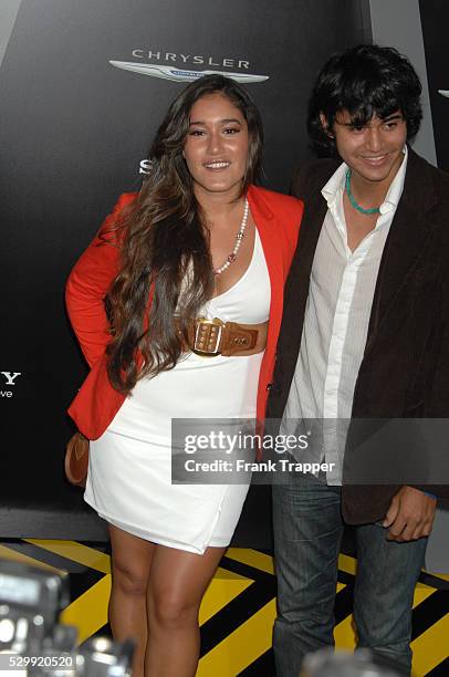 Actress Q'Orianka Kilcher and guest arrive at the premiere of Total Recall held at Grauman's Chinese Theater in Hollywood.