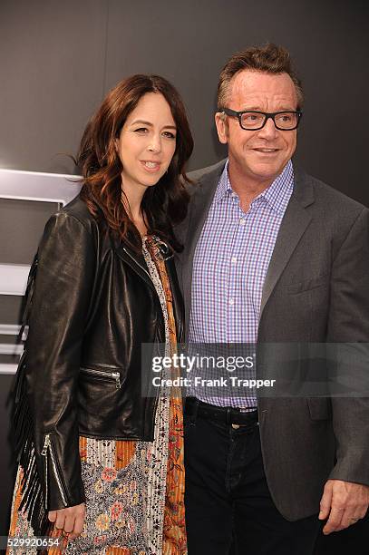Actor Tom Arnold and wife Ashley Groussman arrive at the premiere of "Terminator Genisys" held at the Dolby Theater in Hollywood.