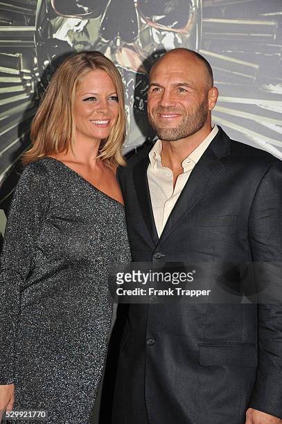 Actor Randy Couture and guest arrive at the premiere of Expendables 2 held at Grauman's Chinese Theater in Hollywood.