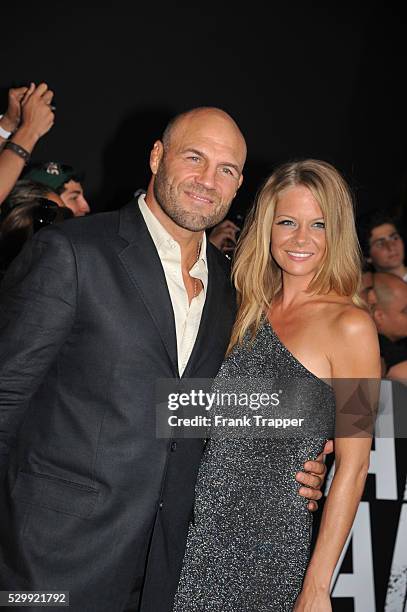 Actor Randy Couture and guest arrive at the premiere of Expendables 2 held at Grauman's Chinese Theater in Hollywood.